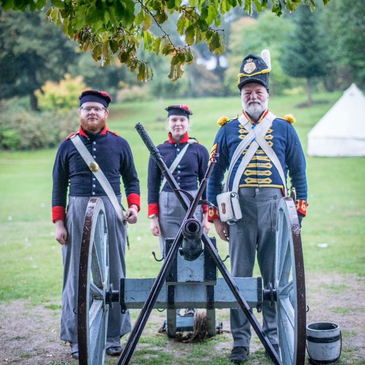 Members of King's German Artillery stood behind a cannon