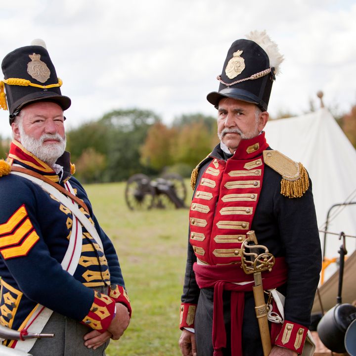 Two members in front of an active event